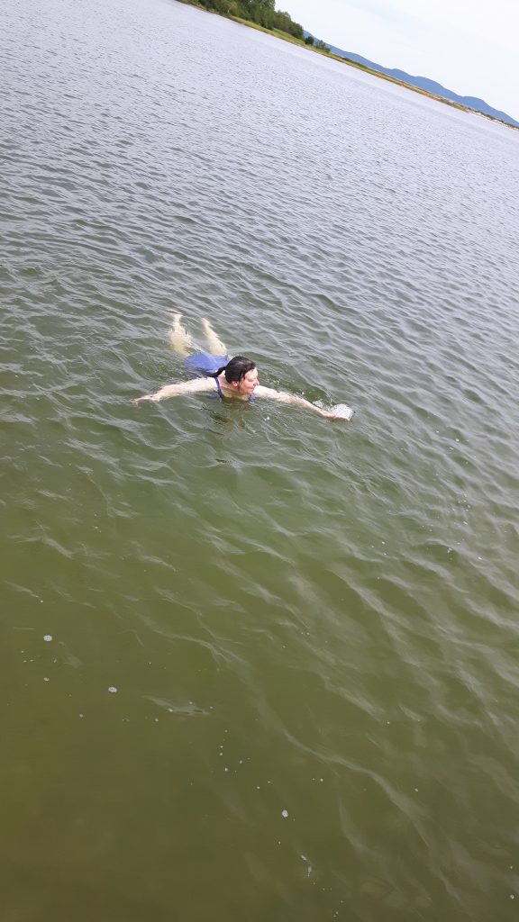 Person swimming in a tipsy world.
